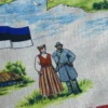 Šviesi prijuostė su Estijos kraštovaizdžiu ir užrašu Estija